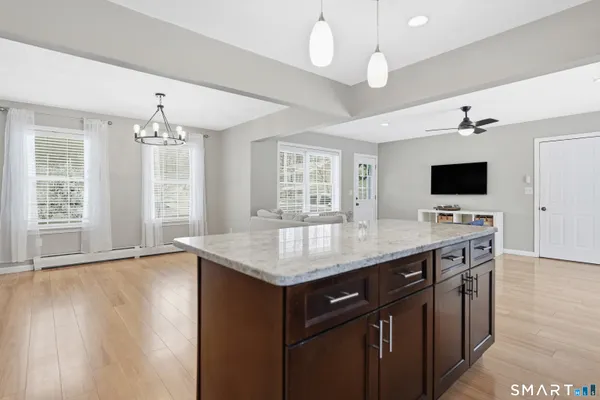 a kitchen with a counter space a sink and a window