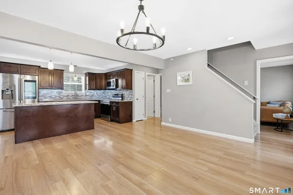 a view of kitchen with sink microwave and stove