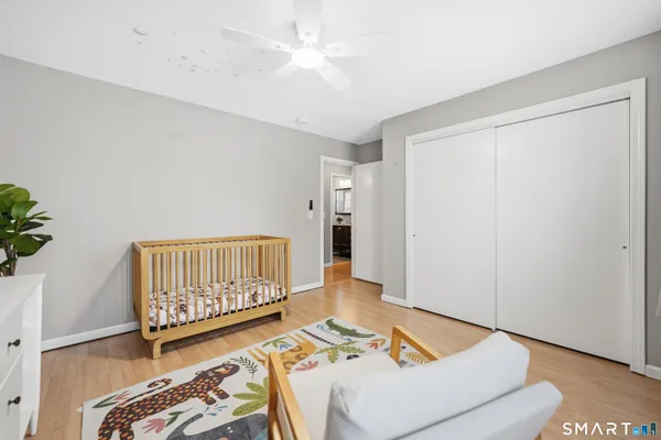 a bedroom with furniture and a window