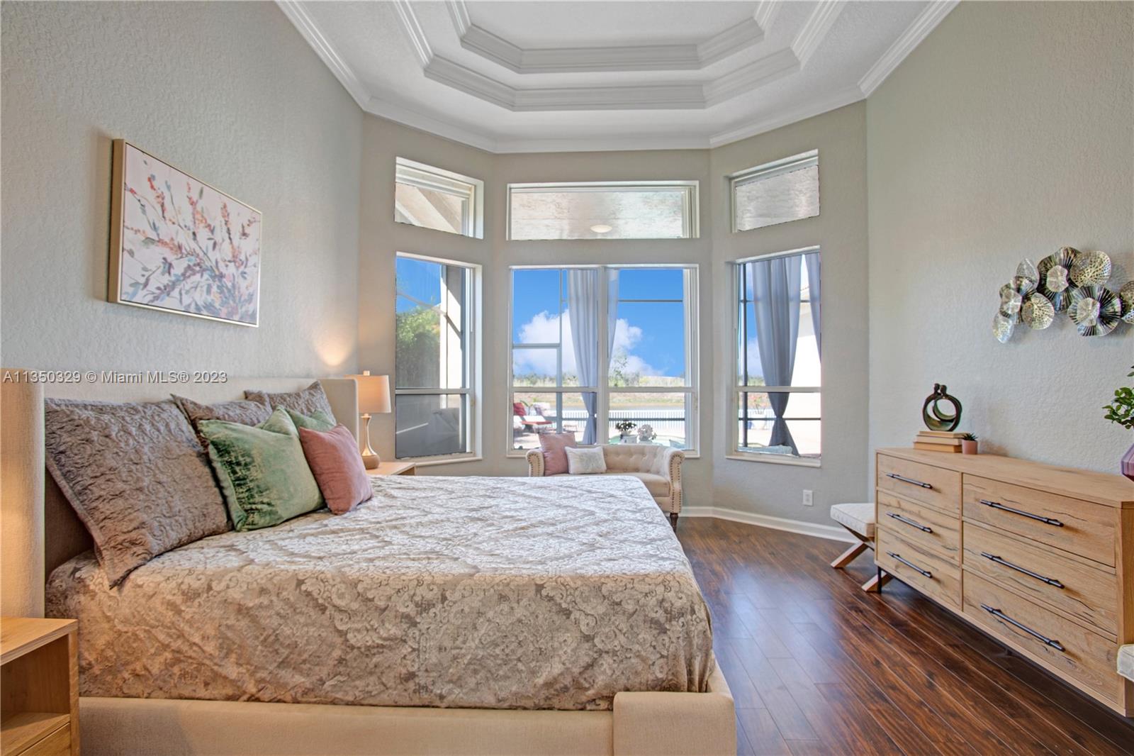 3060 Southwest 195th Terrace Miramar, FL 33029 - Photo 11 of 76 a bedroom with a large bed and a window