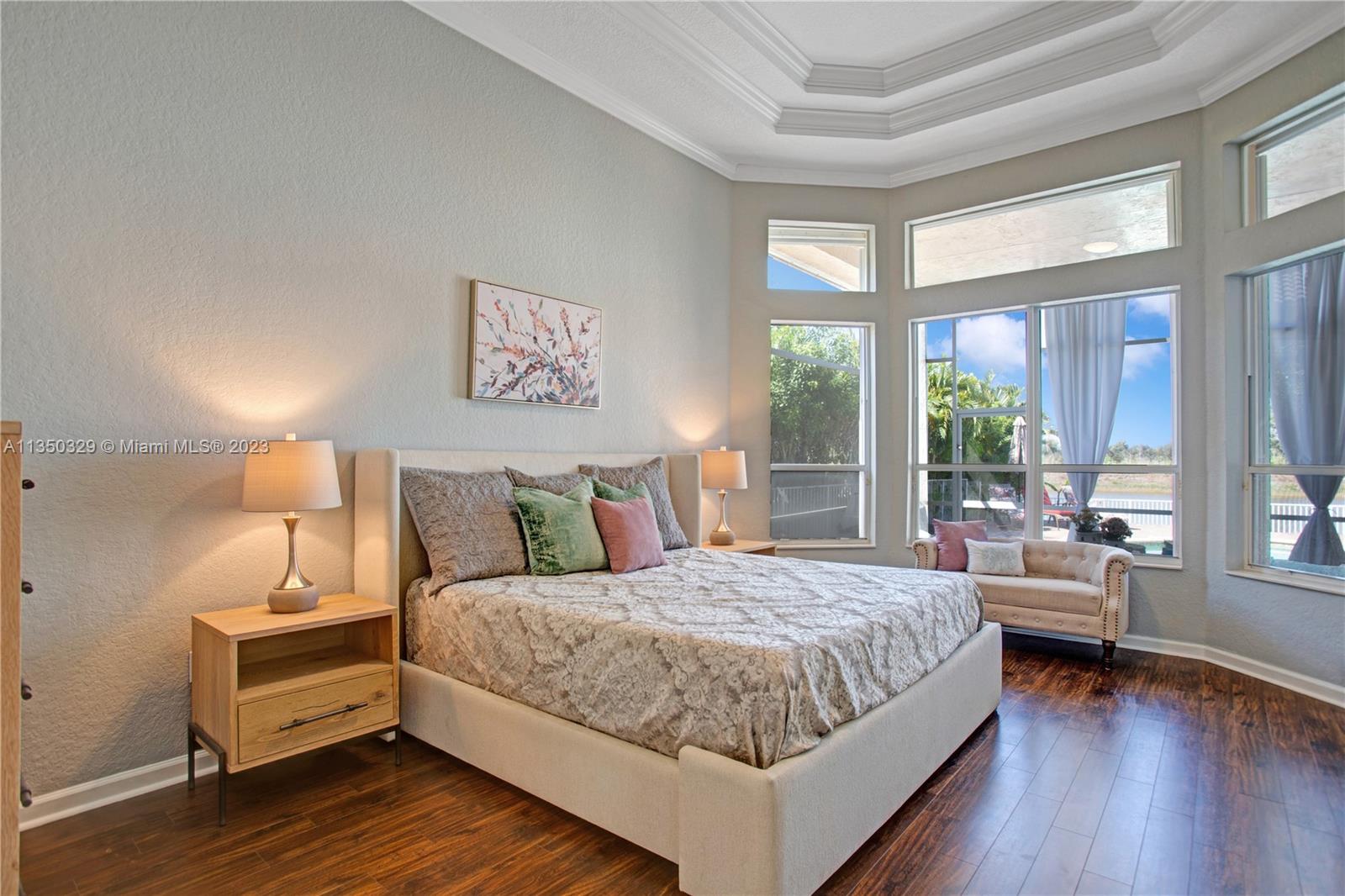 3060 Southwest 195th Terrace Miramar, FL 33029 - Photo 12 of 76 a bedroom with a bed and a large window