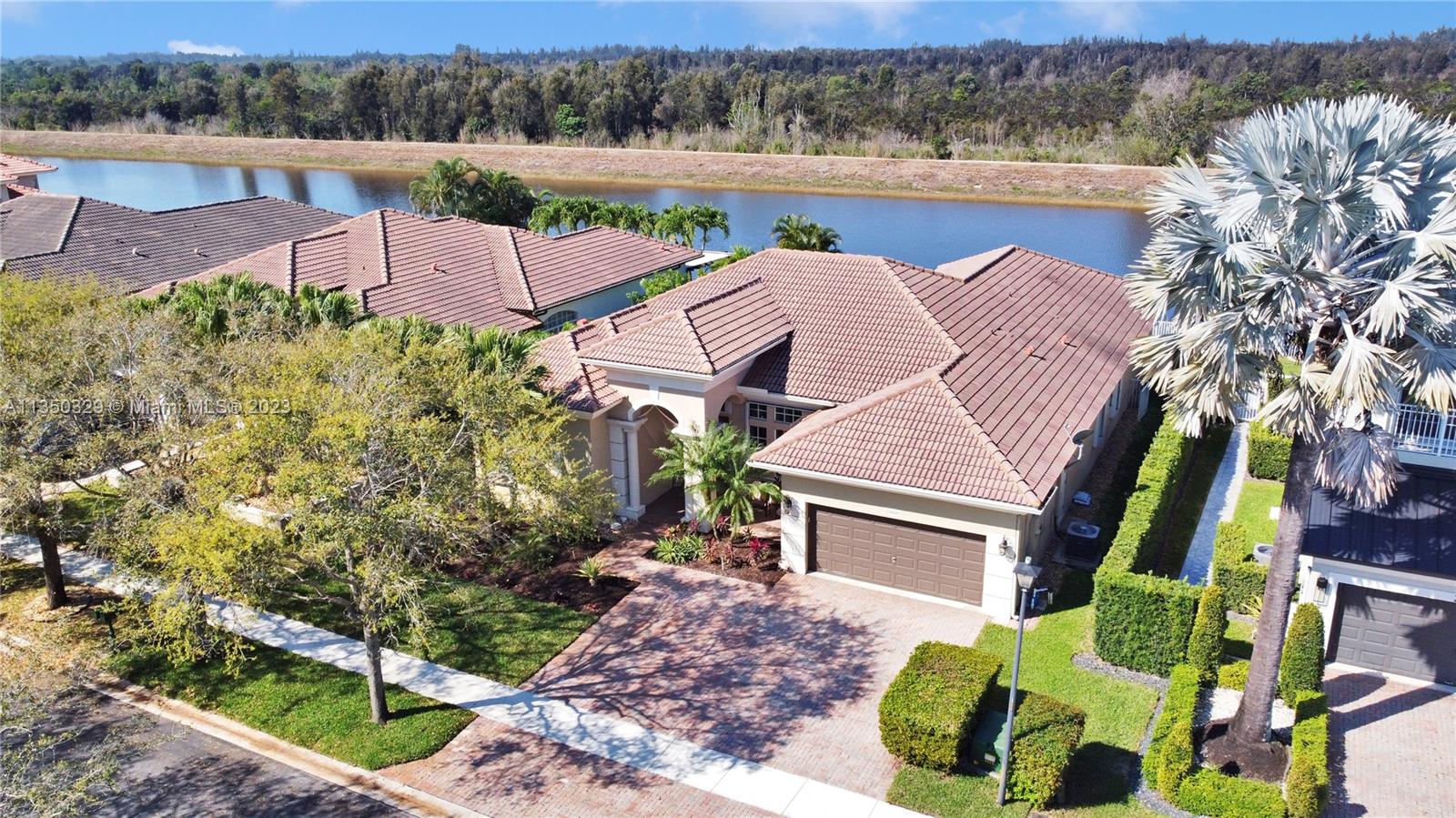 3060 Southwest 195th Terrace Miramar, FL 33029 - Photo 2 of 76 a aerial view of a house with garden space and a patio