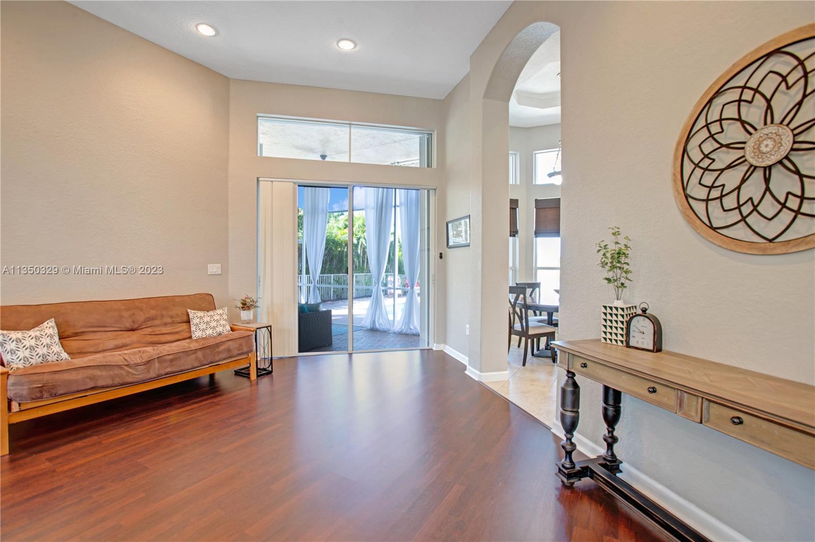 3060 Southwest 195th Terrace Miramar, FL 33029 - Photo 24 of 76 a living room with furniture and a wooden floor