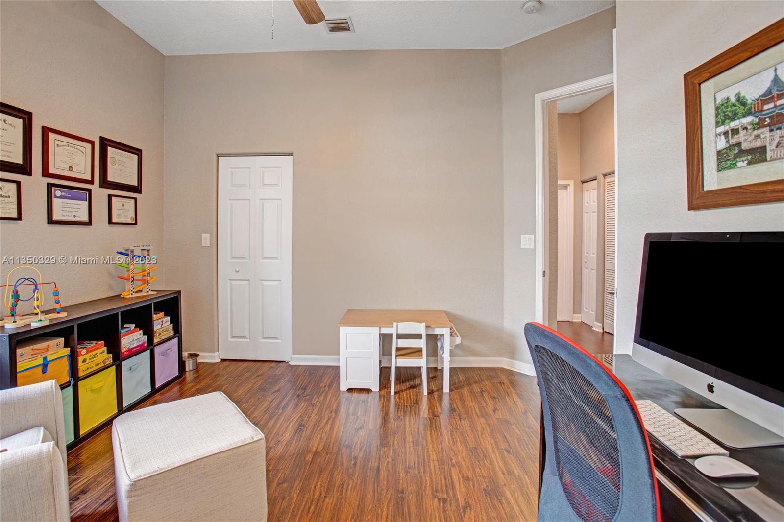 3060 Southwest 195th Terrace Miramar, FL 33029 - Photo 26 of 76 a living room with furniture and a flat screen tv