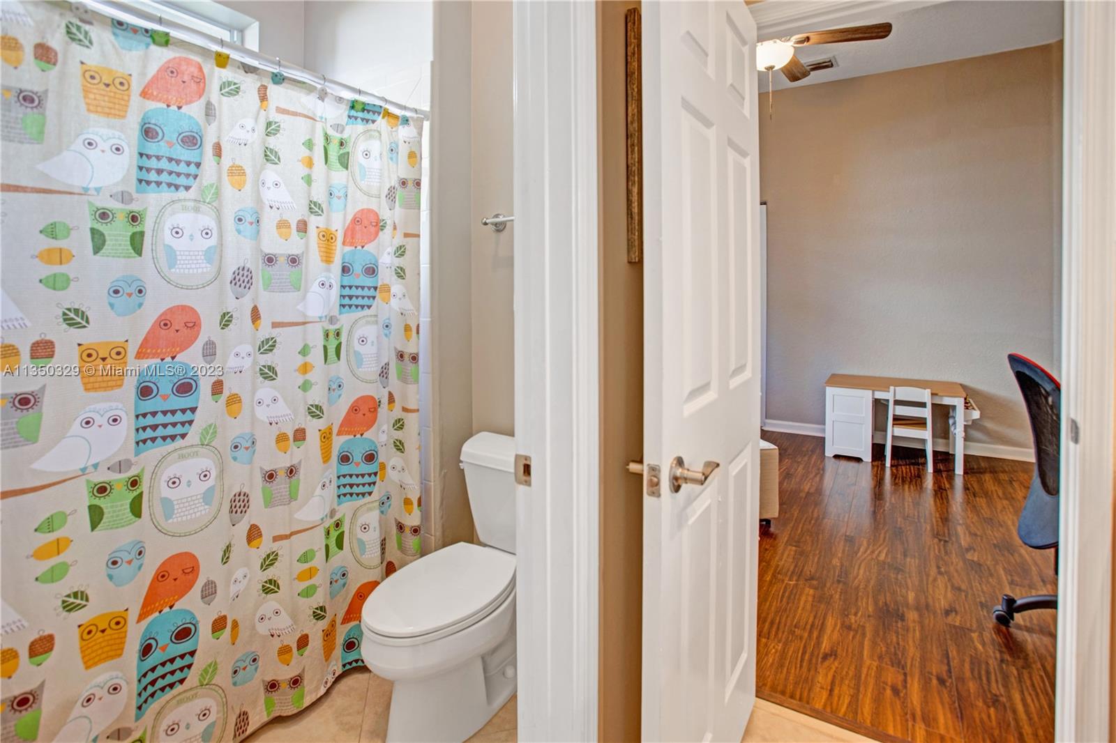 3060 Southwest 195th Terrace Miramar, FL 33029 - Photo 29 of 76 a white toilet sitting next to a shower curtain