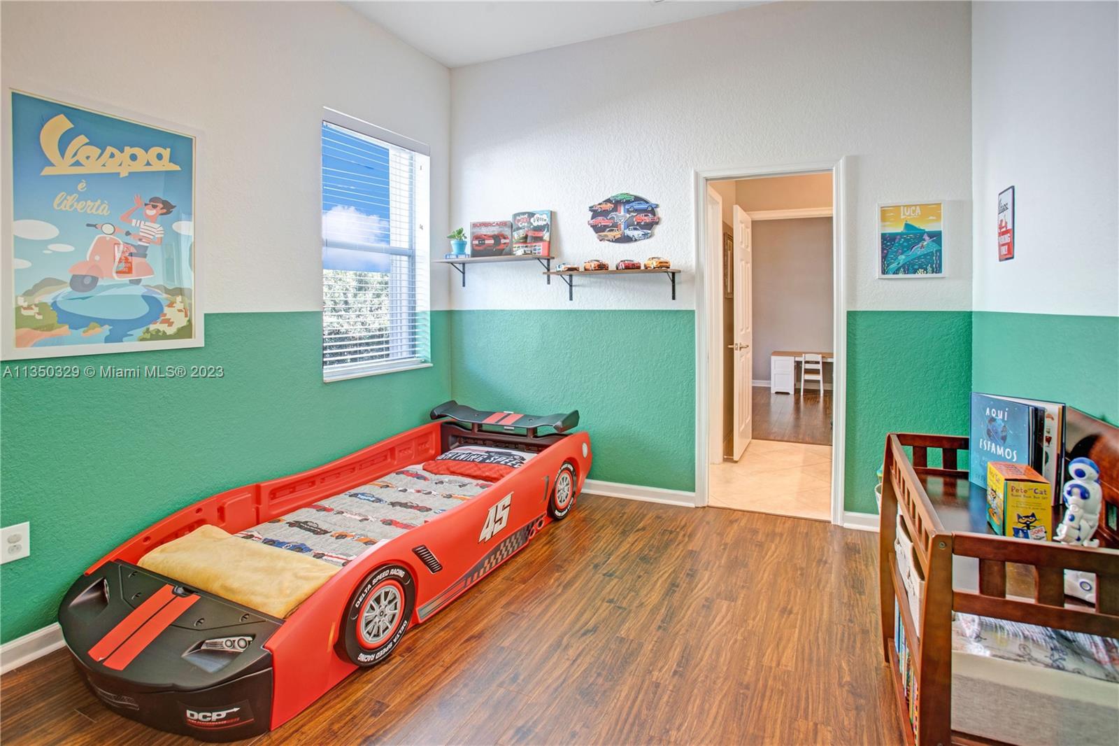 3060 Southwest 195th Terrace Miramar, FL 33029 - Photo 31 of 76 a room with furniture and a book shelf