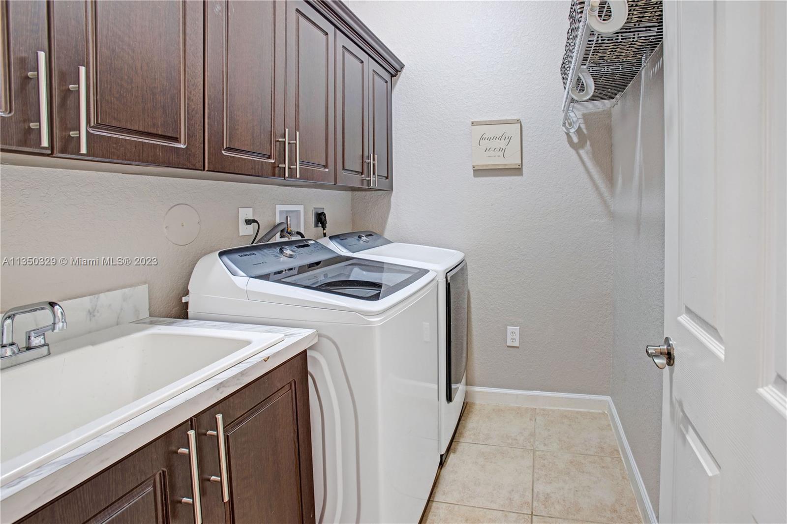 3060 Southwest 195th Terrace Miramar, FL 33029 - Photo 32 of 76 a utility room with dryer and washer