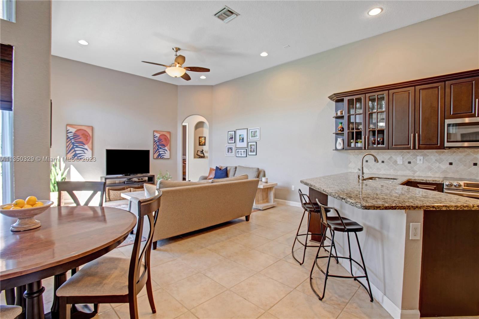 3060 Southwest 195th Terrace Miramar, FL 33029 - Photo 33 of 76 a living room with furniture and a flat screen tv