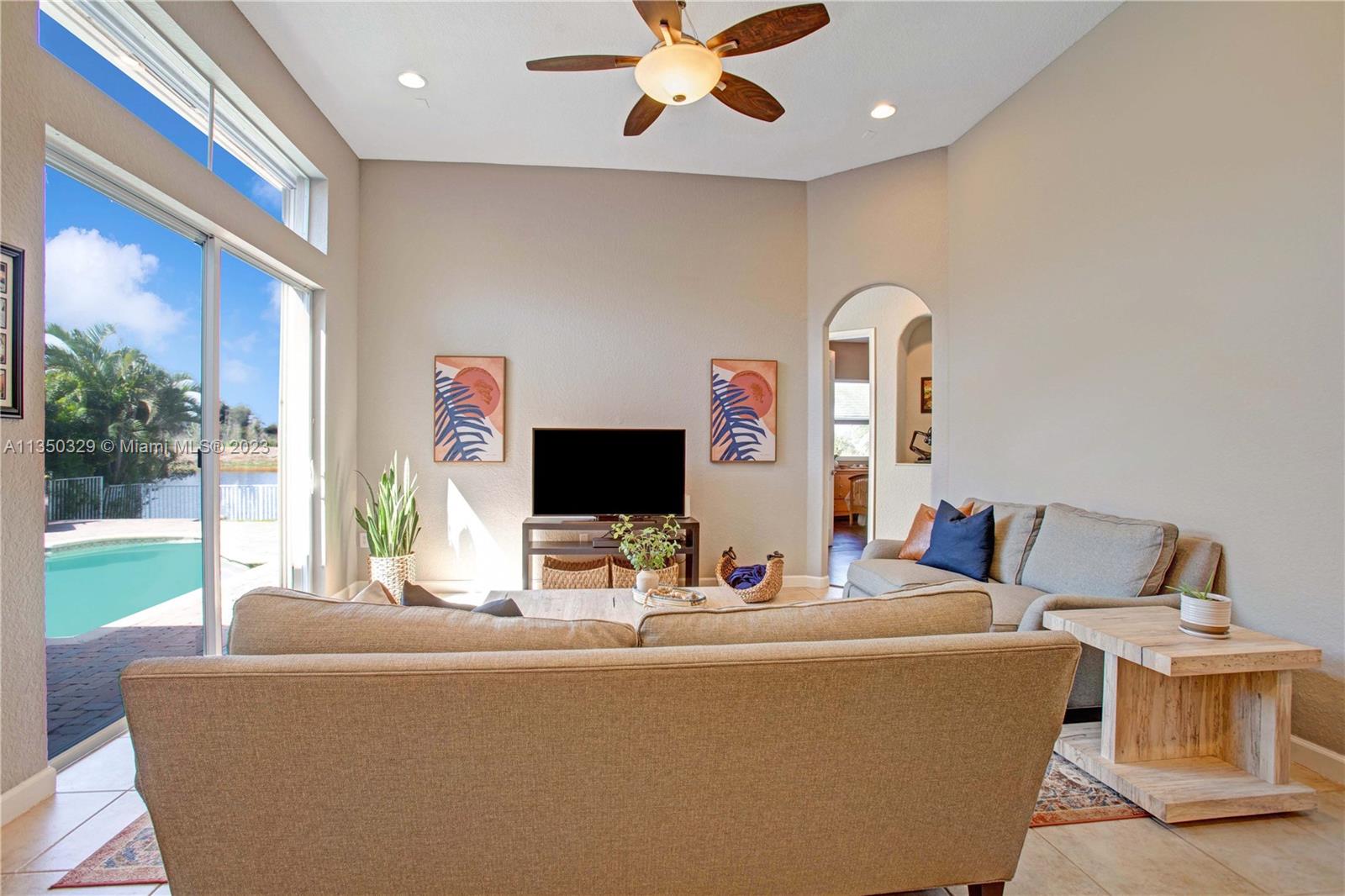 3060 Southwest 195th Terrace Miramar, FL 33029 - Photo 37 of 76 a living room with furniture and a flat screen tv
