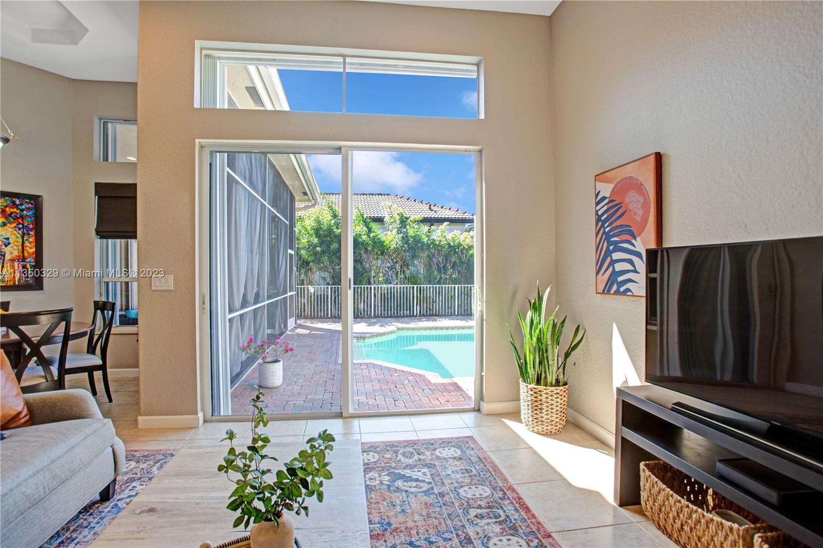 3060 Southwest 195th Terrace Miramar, FL 33029 - Photo 42 of 76 a living room with furniture and a potted plant