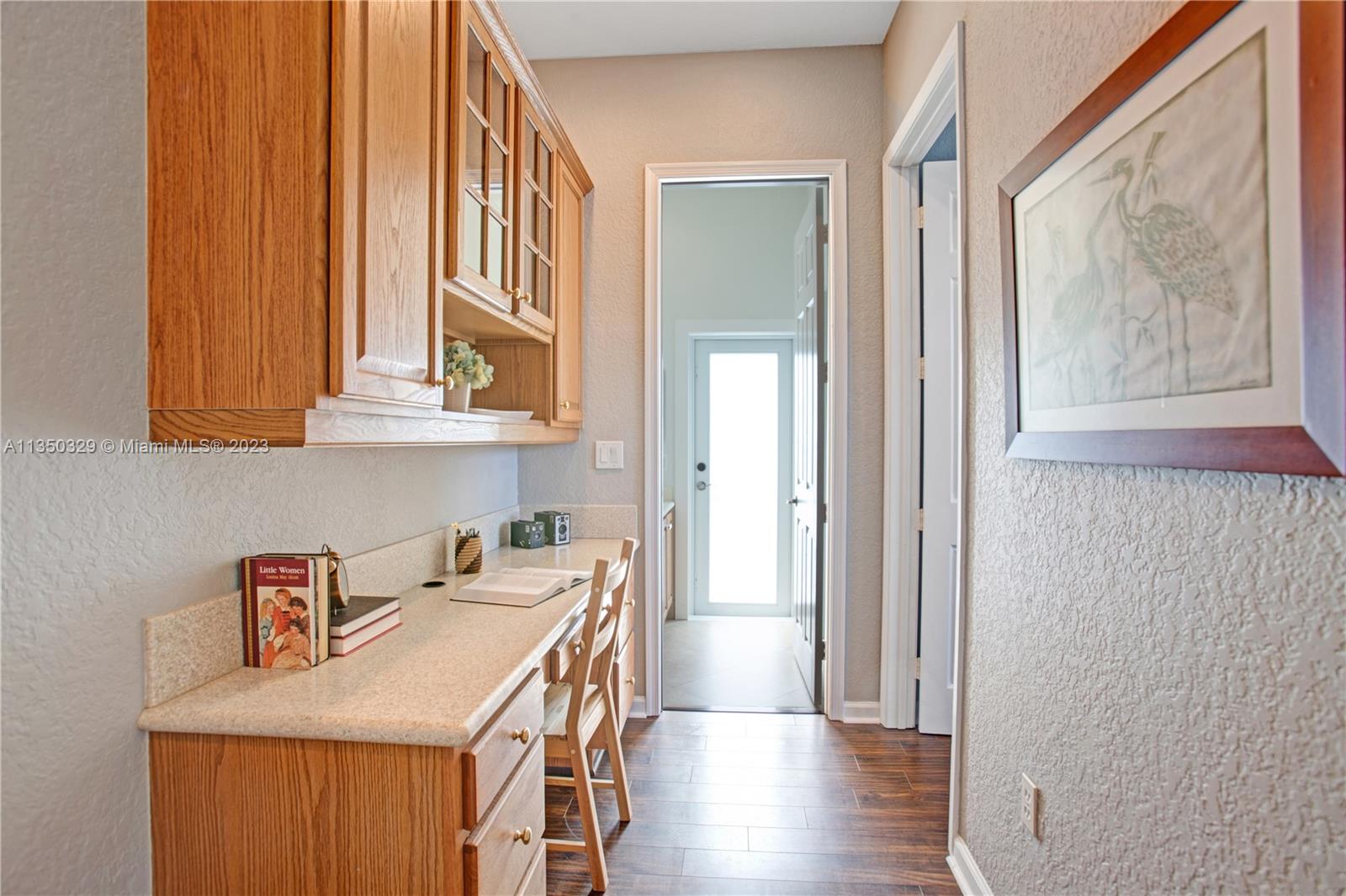 3060 Southwest 195th Terrace Miramar, FL 33029 - Photo 44 of 76 a kitchen with stainless steel appliances granite countertop a sink a stove and a refrigerator with wooden floor