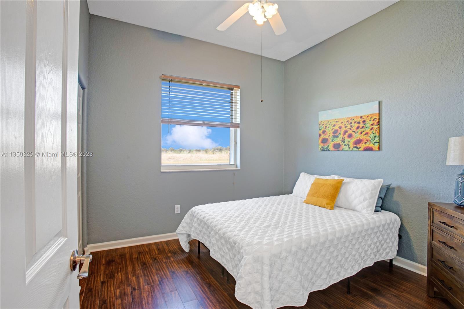 3060 Southwest 195th Terrace Miramar, FL 33029 - Photo 45 of 76 a bedroom with a bed and wooden floor