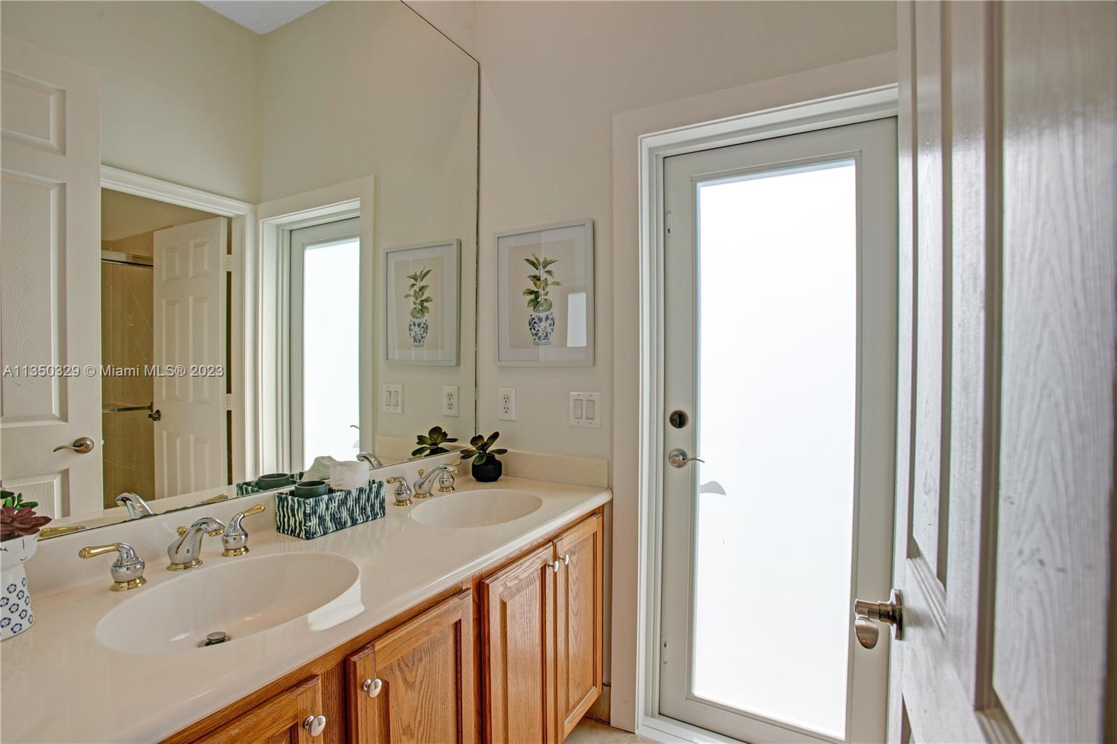 3060 Southwest 195th Terrace Miramar, FL 33029 - Photo 46 of 76 a bathroom with a sink and a mirror