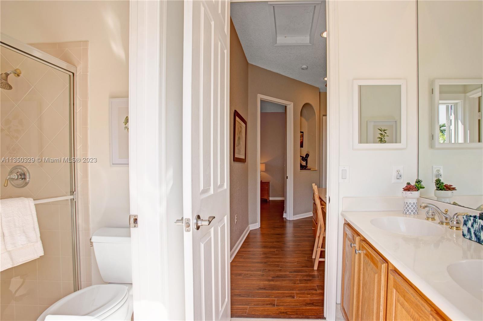 3060 Southwest 195th Terrace Miramar, FL 33029 - Photo 48 of 76 a bathroom with a sink a toilet a tub and shower