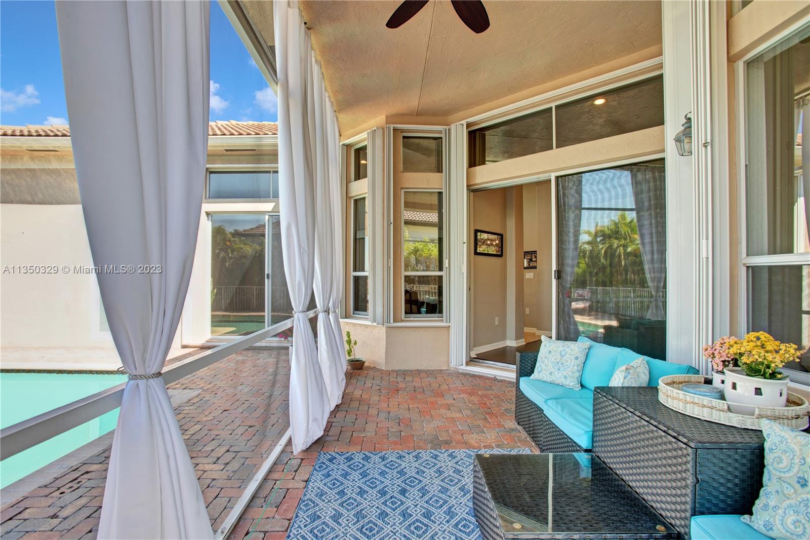 3060 Southwest 195th Terrace Miramar, FL 33029 - Photo 50 of 76 a living room with furniture and a window