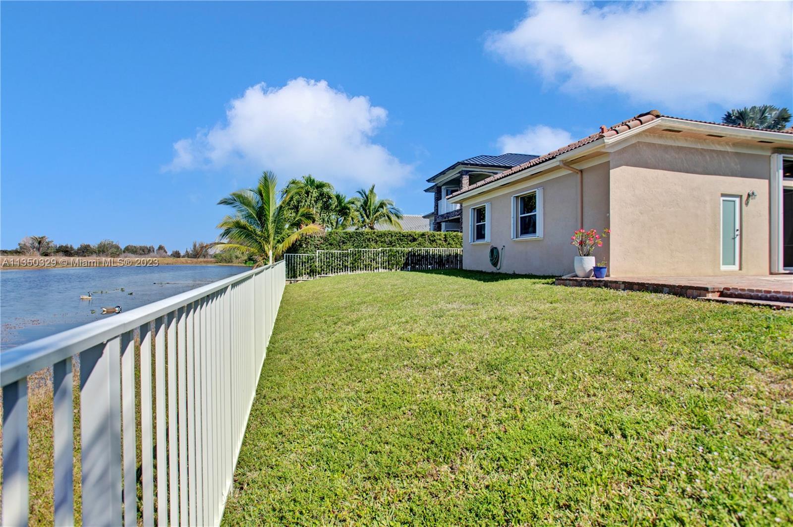 3060 Southwest 195th Terrace Miramar, FL 33029 - Photo 56 of 76 a view of a house with a yard