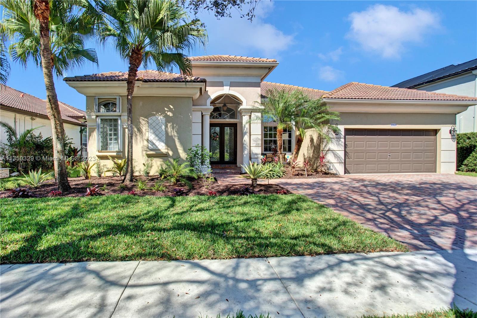 3060 Southwest 195th Terrace Miramar, FL 33029 - Photo 8 of 76 a front view of a house with garden