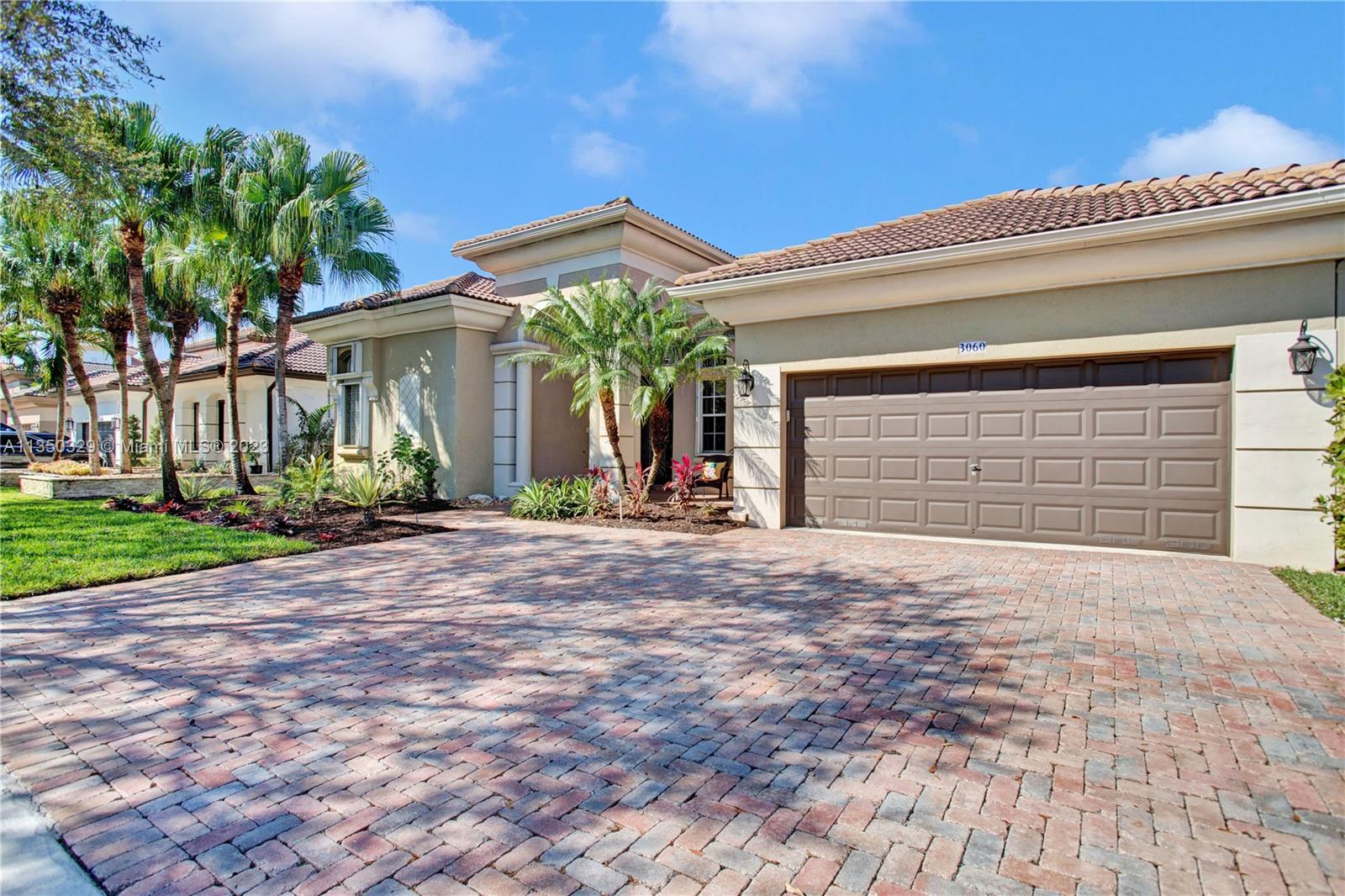 3060 Southwest 195th Terrace Miramar, FL 33029 - Photo 9 of 76 a front view of a house with a yard and garage