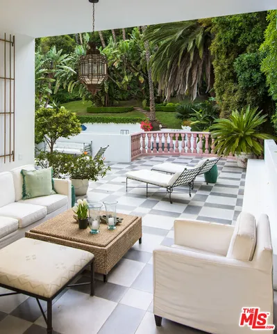 a outdoor living space with furniture and garden view