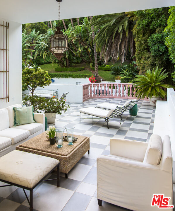 a outdoor living space with furniture and garden view