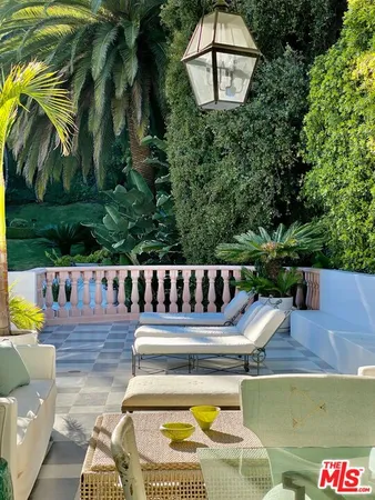 a view of a chairs and table in the patio