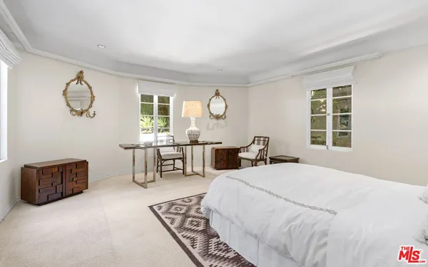 a bed room with a bed and a window