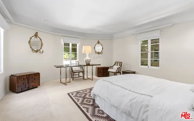 a bed room with a bed and a window