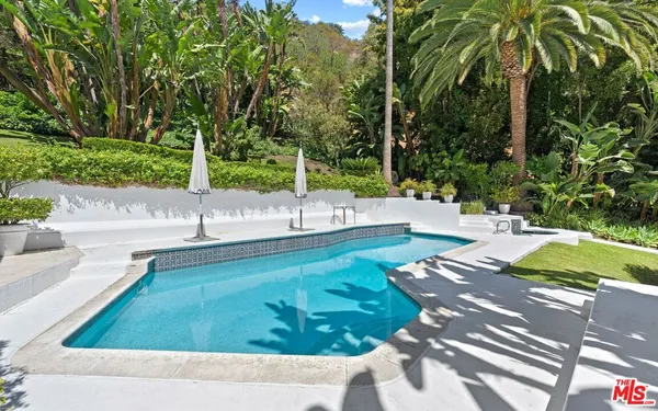 a view of a swimming pool with a patio