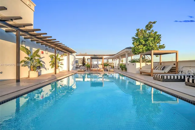 a view of a swimming pool with a porch
