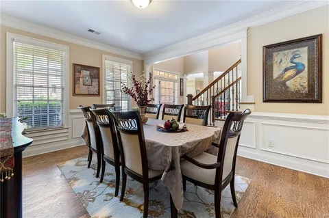 a kitchen with stainless steel appliances granite countertop a refrigerator stove and sink