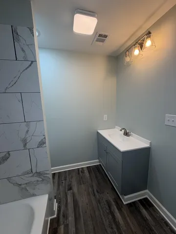 a bathroom with a sink and mirror
