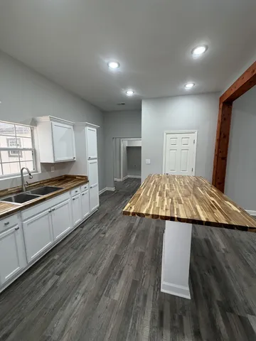 a kitchen with a sink and cabinets