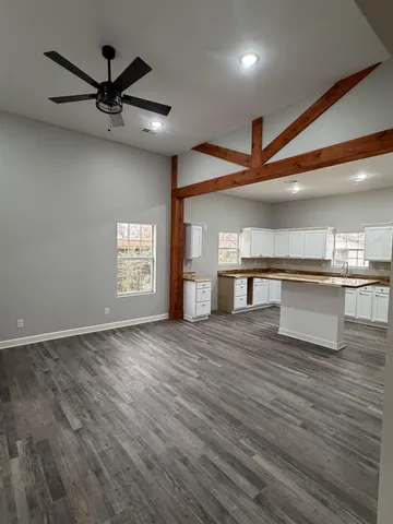 a view of a kitchen with a sink and a window