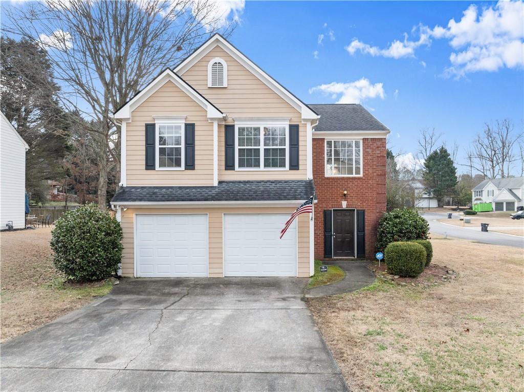 5050 Arbor View Way Sugar Hill, GA 30518 - Photo 1 of 1 a view of a house with a yard and plants