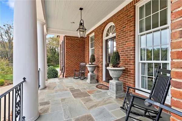 a kitchen with stainless steel appliances a sink a stove and a wooden floors