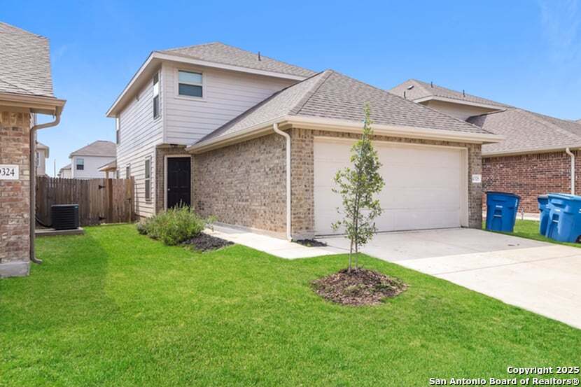 10328 Green Branch San Antonio, TX 78223 - Photo 2 of 16 a white house with a small yard and a small yard