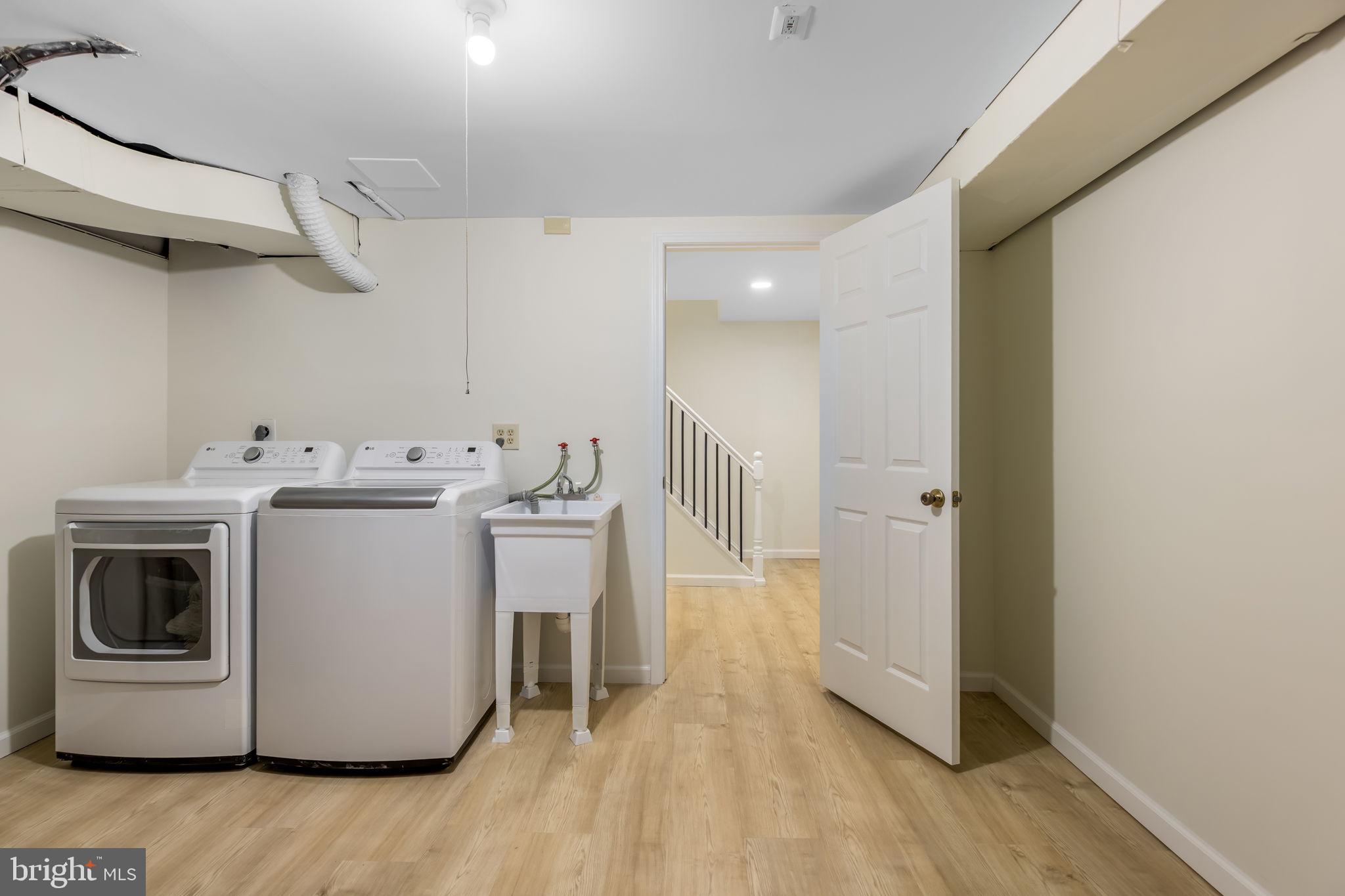 8371 Luce Court Springfield, VA 22153 - Photo 19 of 21 a utility room with washer and dryer