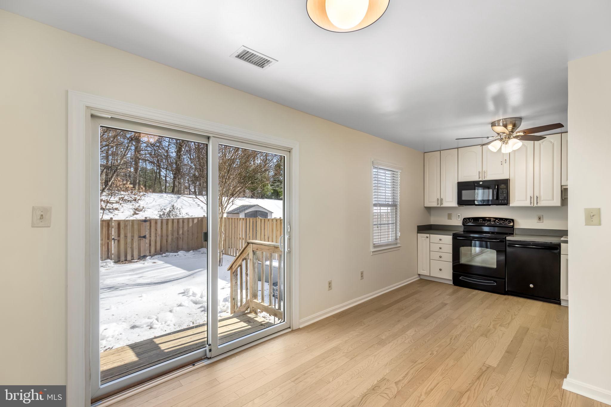 8371 Luce Court Springfield, VA 22153 - Photo 5 of 21 a kitchen with stainless steel appliances granite countertop a refrigerator stove top oven and sink