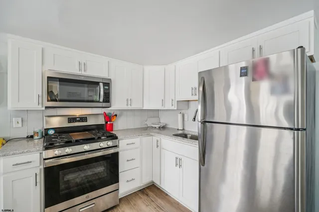 a living room with furniture and a rug