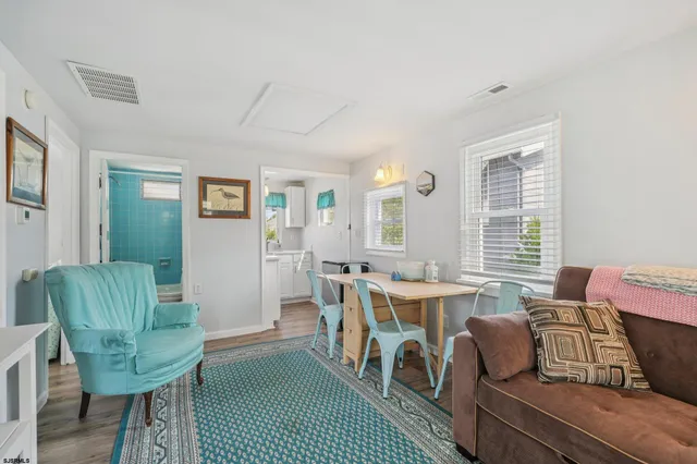 a bedroom with furniture and a workspace