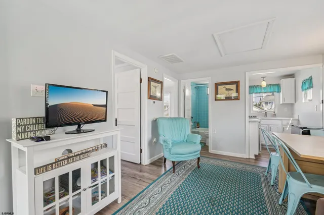a bathroom with a sink mirror and vanity