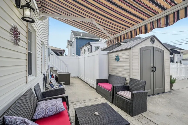 a view of a patio with couches and chairs