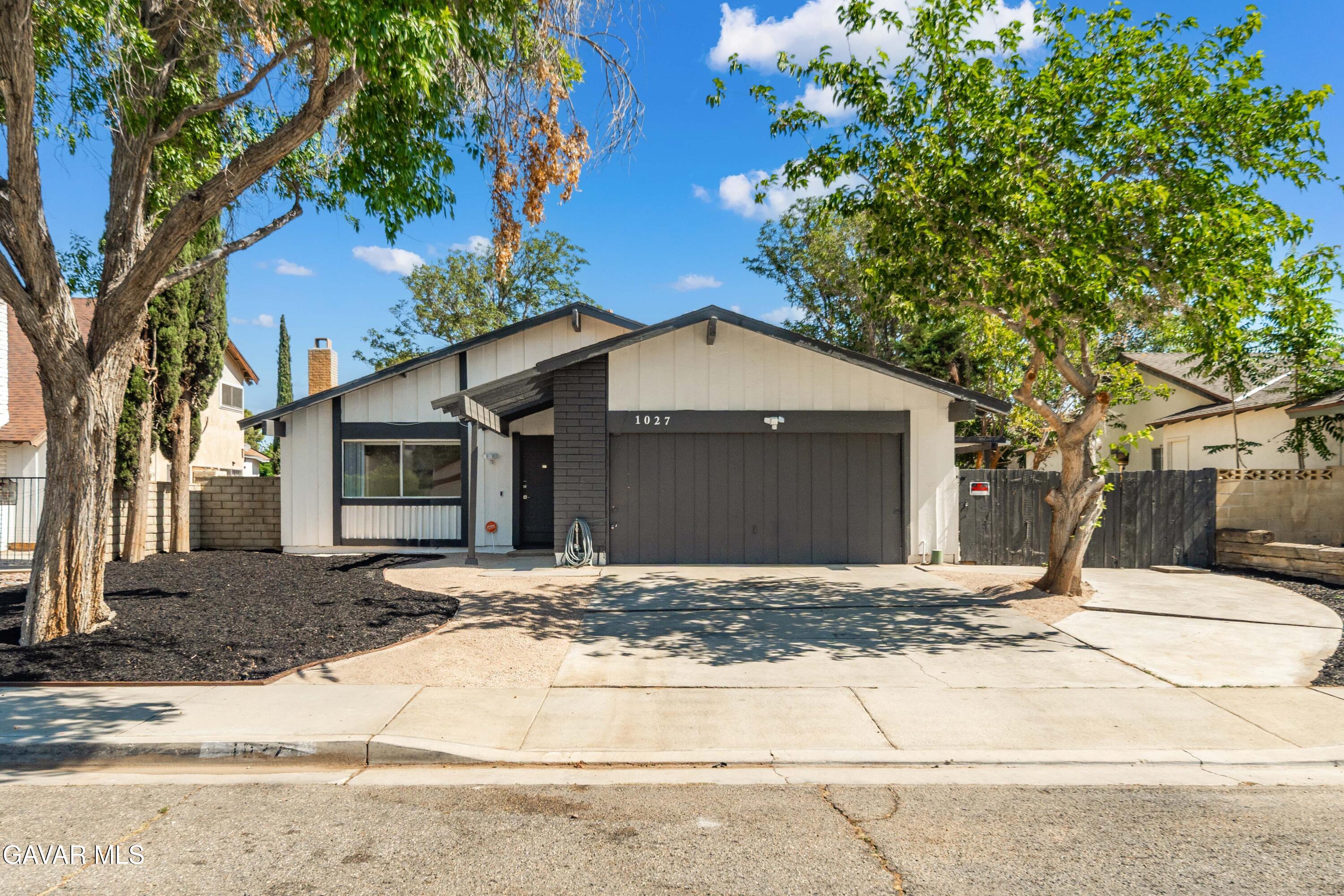 a house with trees in the background