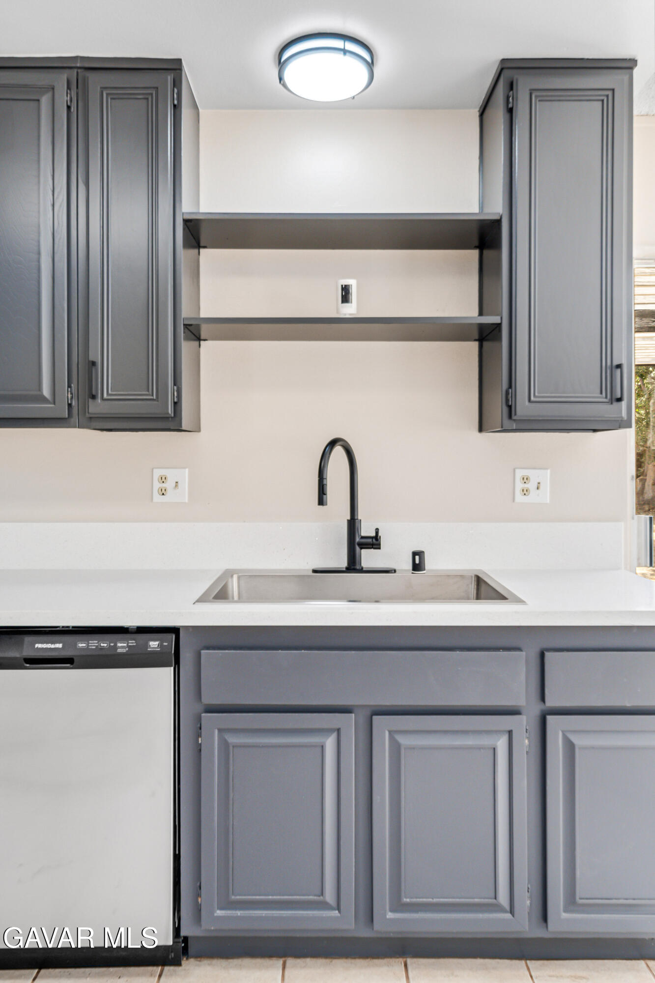 1027 Caperton Street Lancaster, CA 93535 - Photo 12 of 30 a kitchen with a sink and cabinets