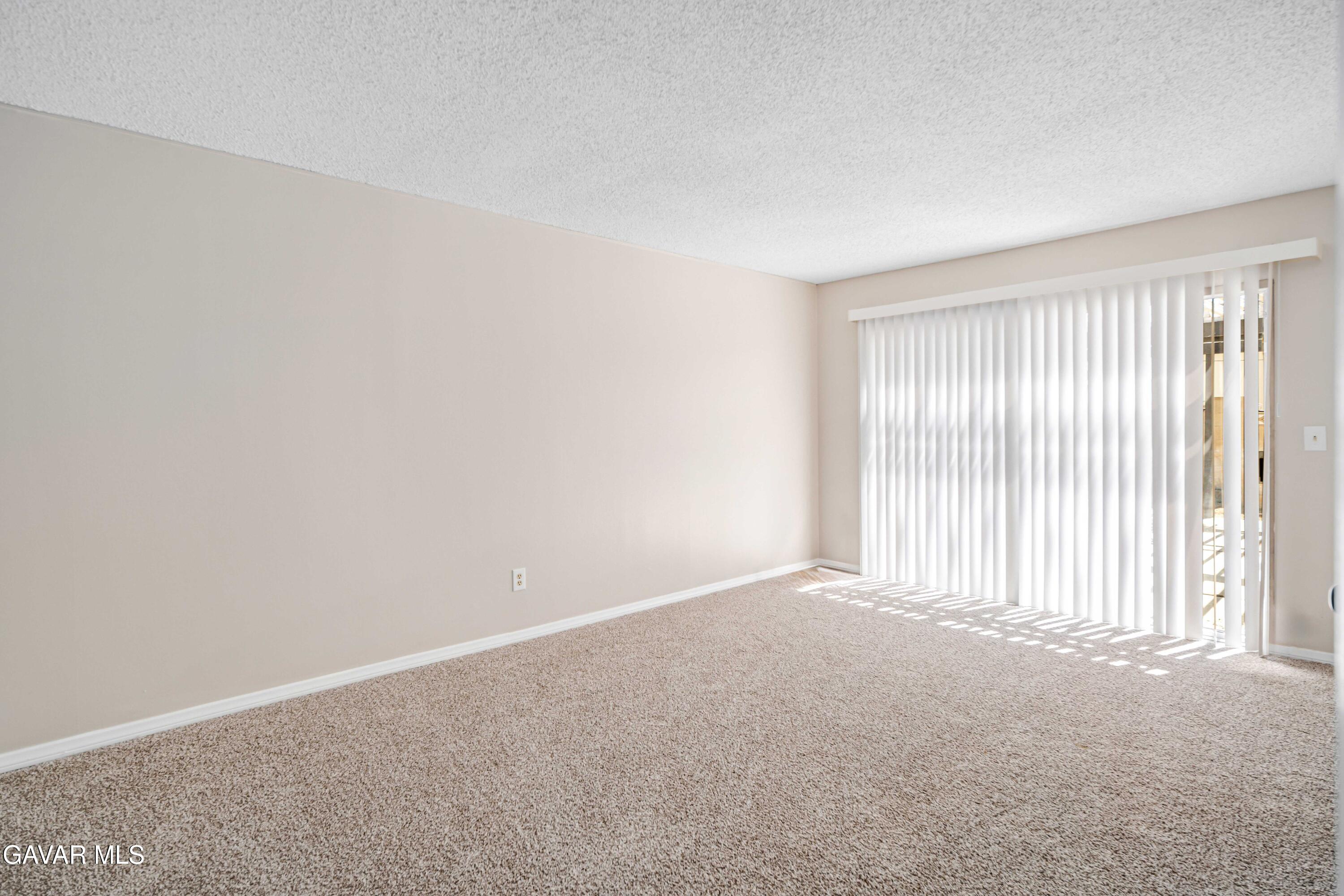 1027 Caperton Street Lancaster, CA 93535 - Photo 17 of 30 an empty room with a window