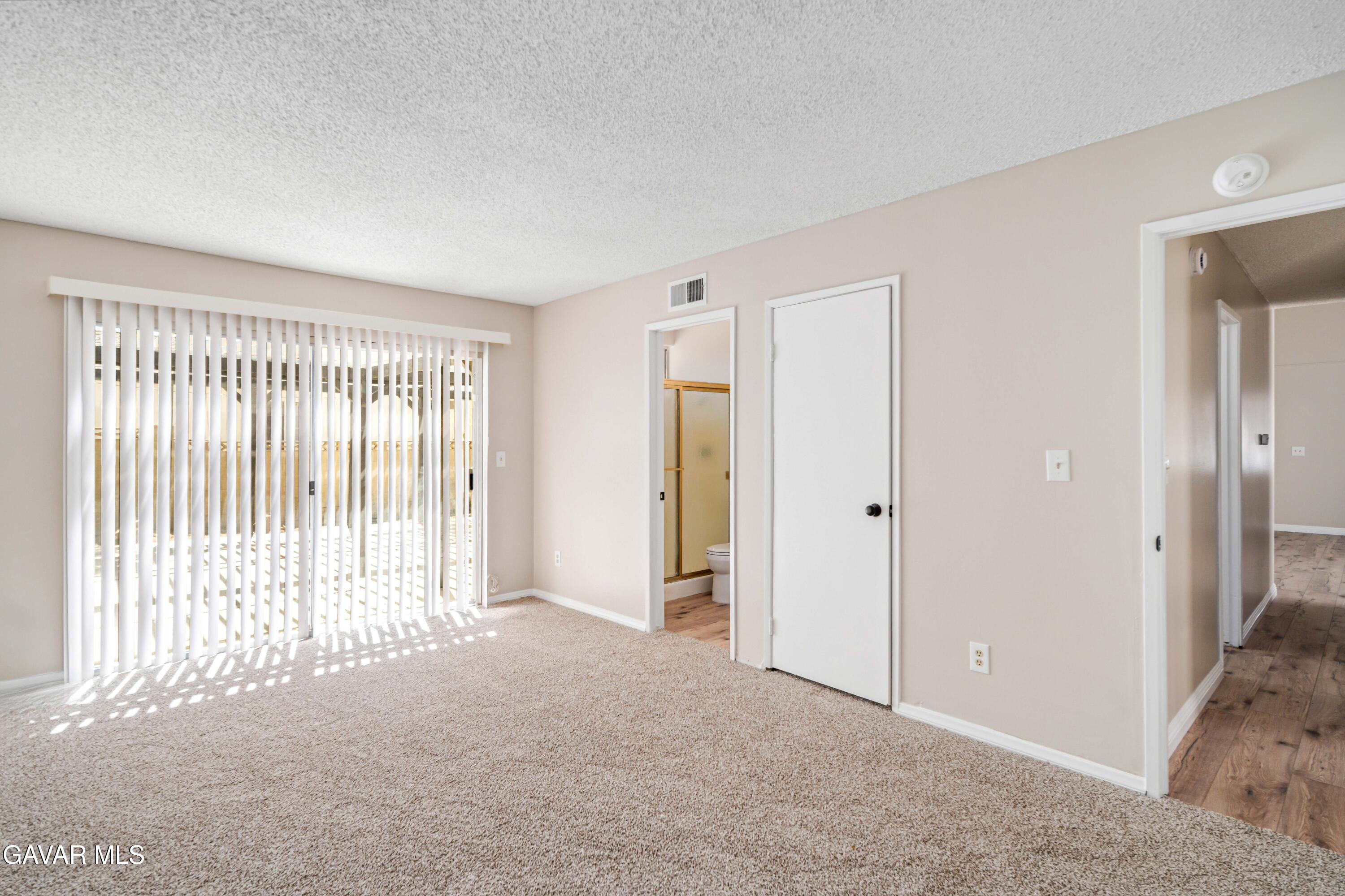 1027 Caperton Street Lancaster, CA 93535 - Photo 19 of 30 a view of a livingroom with an empty space and a window