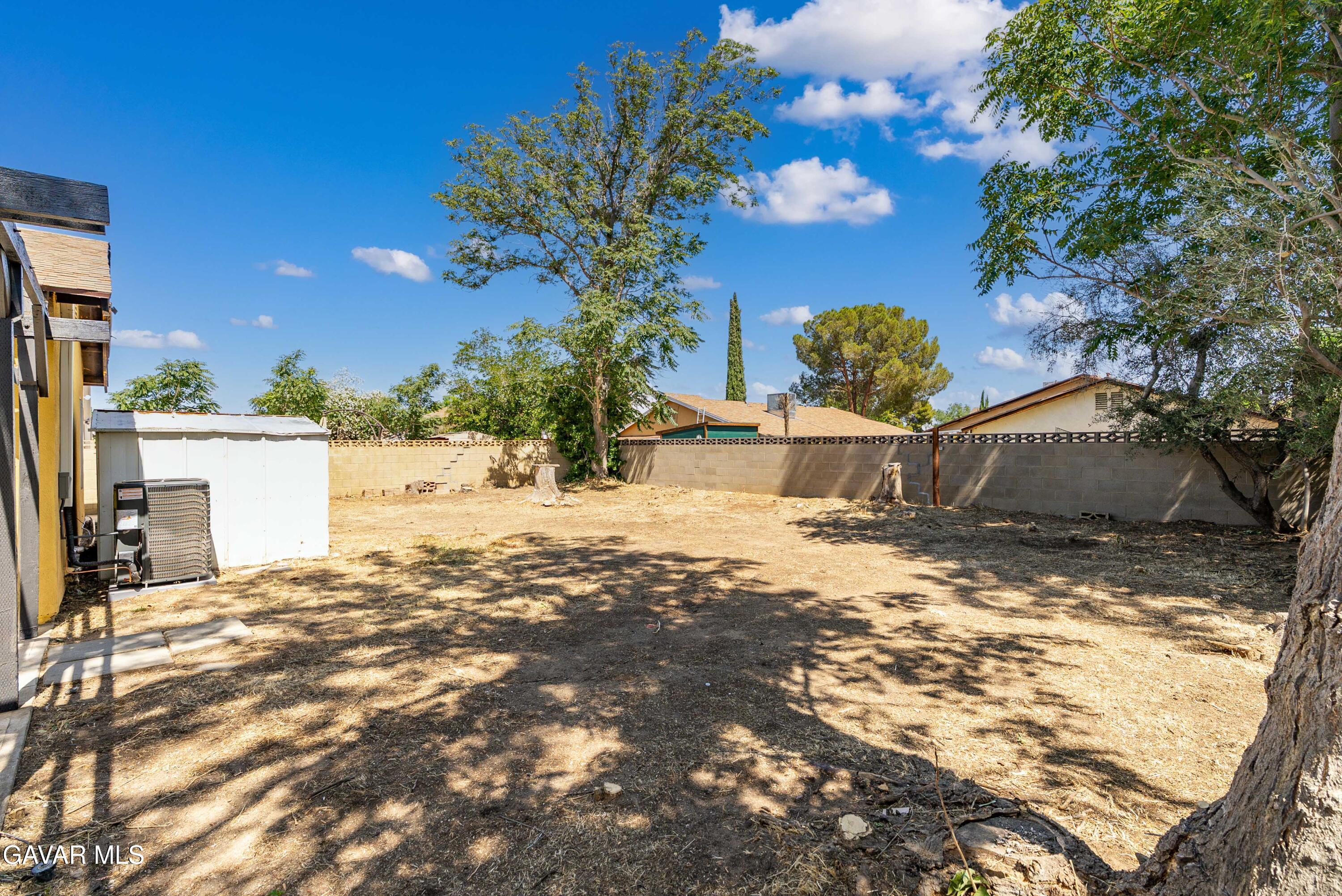 1027 Caperton Street Lancaster, CA 93535 - Photo 27 of 30 a view of a yard covered in snow