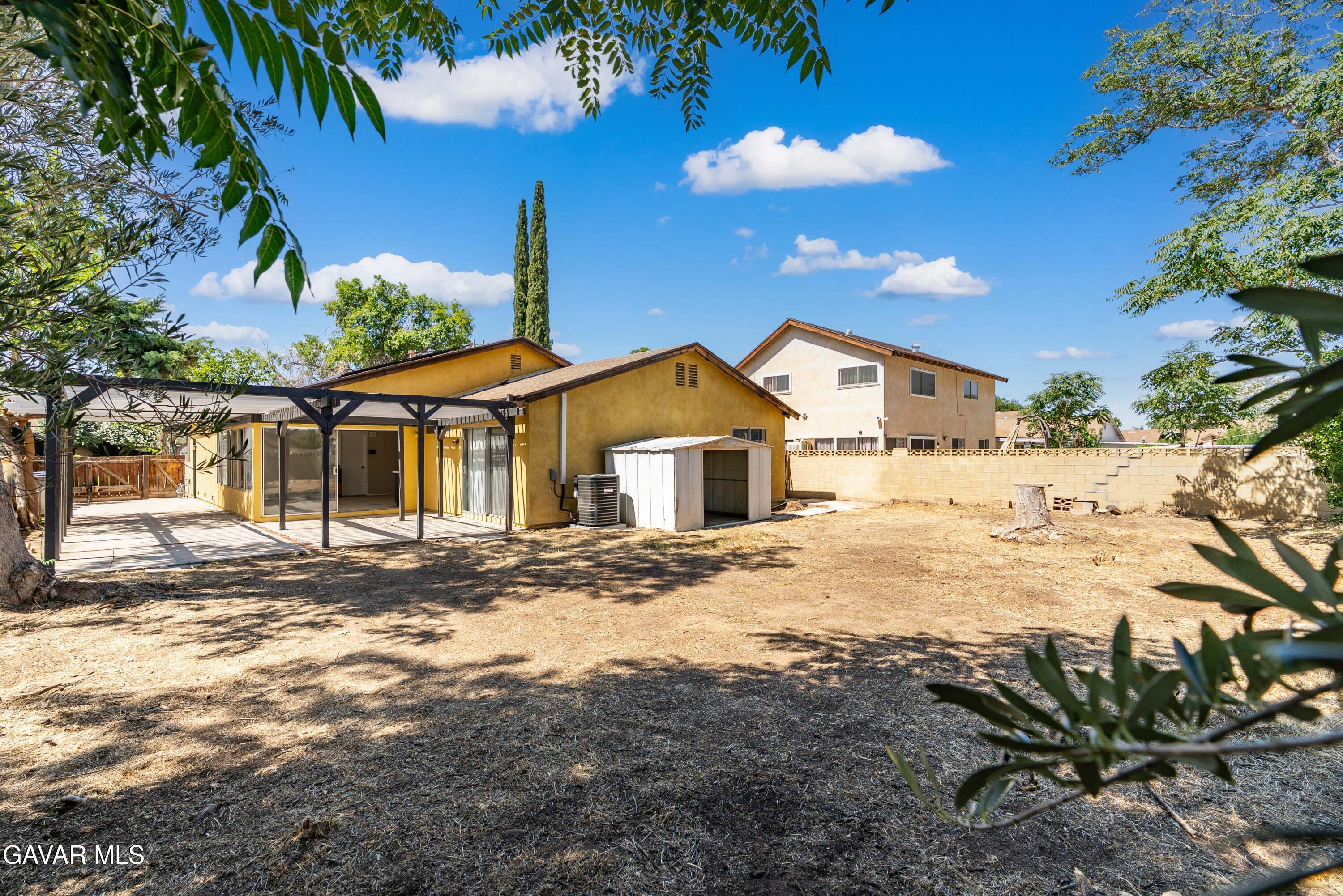 1027 Caperton Street Lancaster, CA 93535 - Photo 28 of 30 a view of a house with a yard
