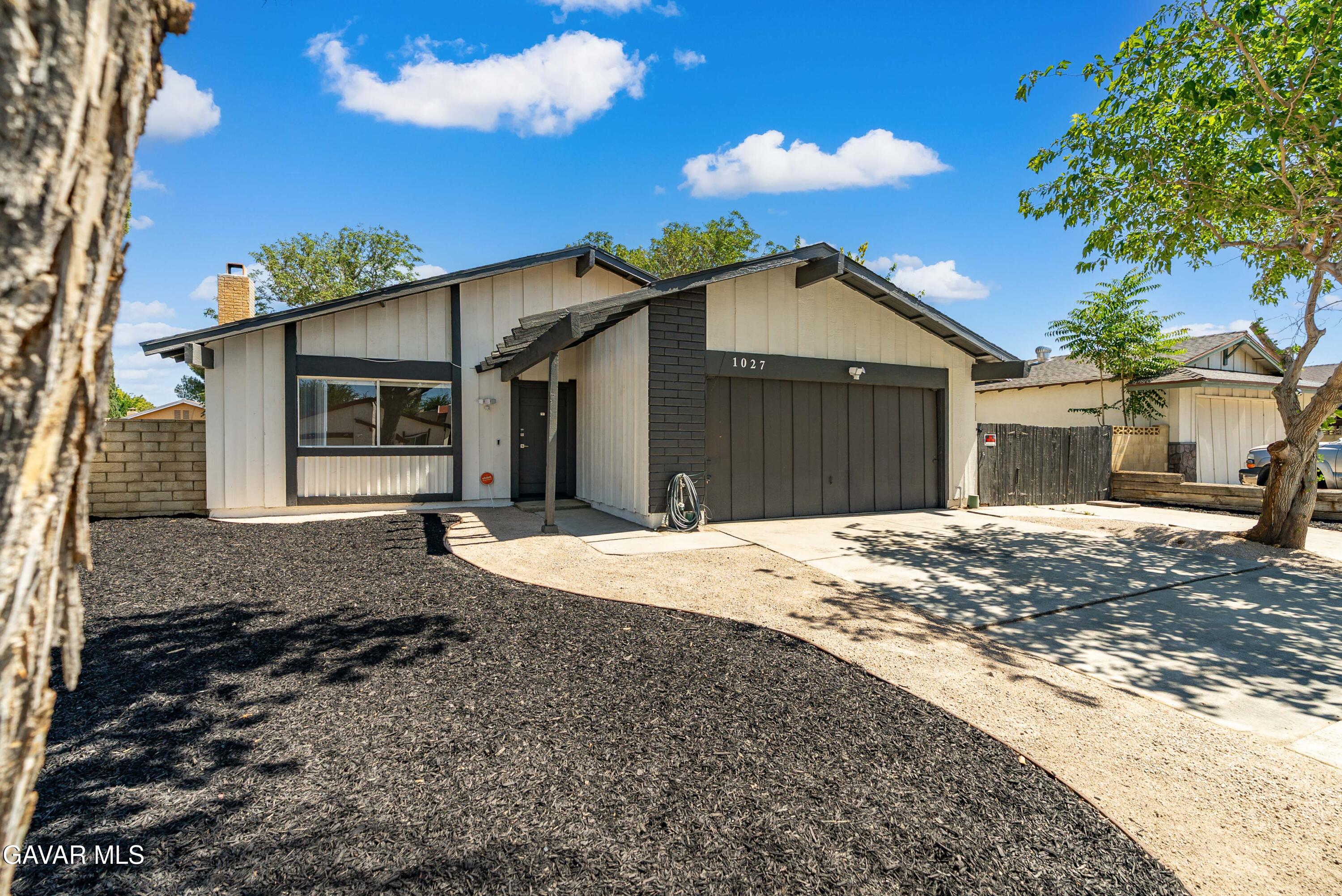 1027 Caperton Street Lancaster, CA 93535 - Photo 3 of 30 a front view of a house with a yard