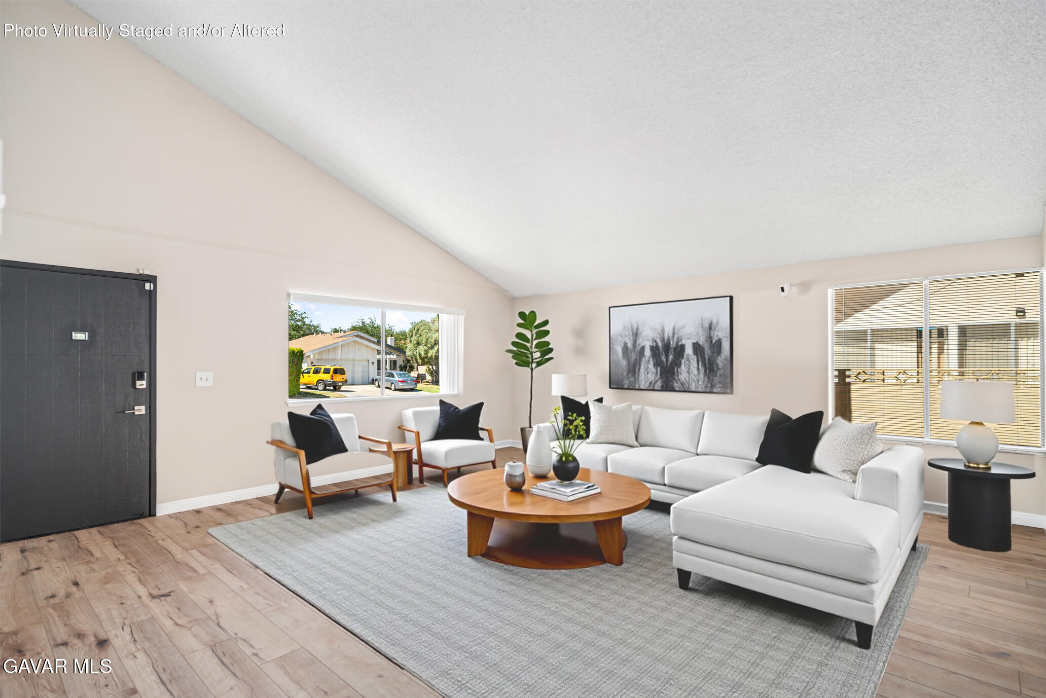 1027 Caperton Street Lancaster, CA 93535 - Photo 7 of 30 a living room with furniture and a wooden floor
